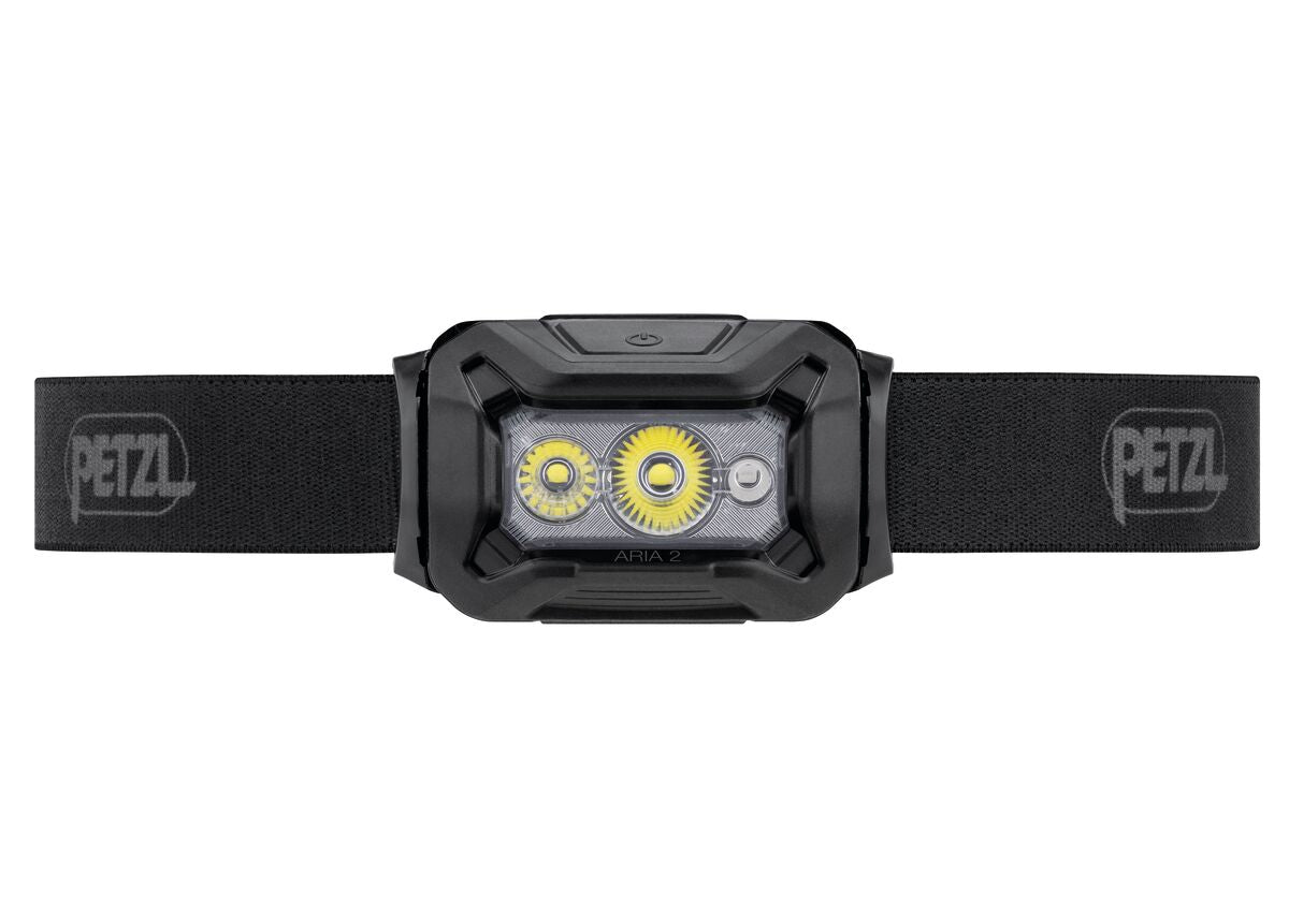PETZL Petzl Kopflampe ARIA® 2 RGB Stirnlampe mit Gummiband, zwei gelben und einer kleinen LED, 450 Lumen Leistung. Einschaltknopf oben; Frontansicht vor weißem Hintergrund.