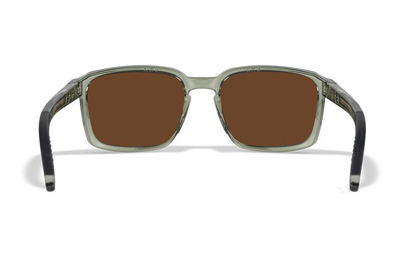 Die WILEY X Sonnenbrille ALFA hat rechteckige braune Gläser und einen transparenten grauen Rahmen, von vorne gesehen. Die Bügel gehen an den Spitzen von Dunkelheit zu Helligkeit in der Nähe der Gläser über und sorgen so für ein schlankes Aussehen.