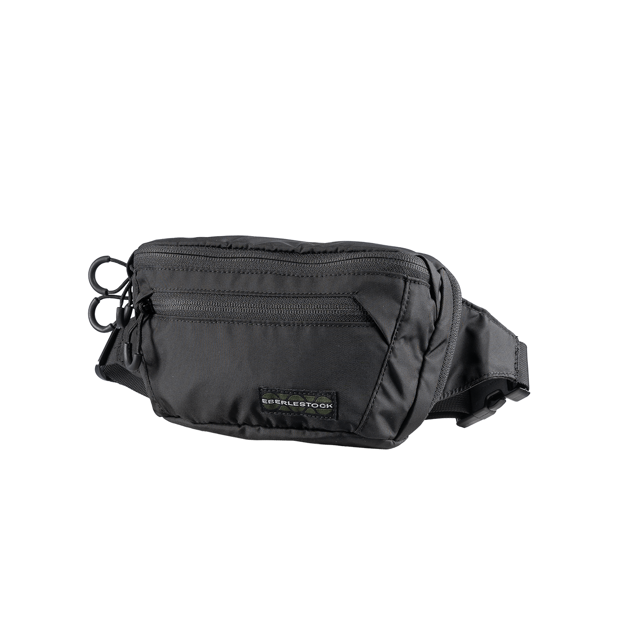 Die EBERLESTOCK Bando Bag Standard ist ein schwarzer taktischer Hüftrucksack mit mehreren Reißverschlussfächern, einem verstellbaren Gurt und einem kleinen Logoanhänger auf der Vorderseite, abgebildet auf einem schlichten weißen Hintergrund.