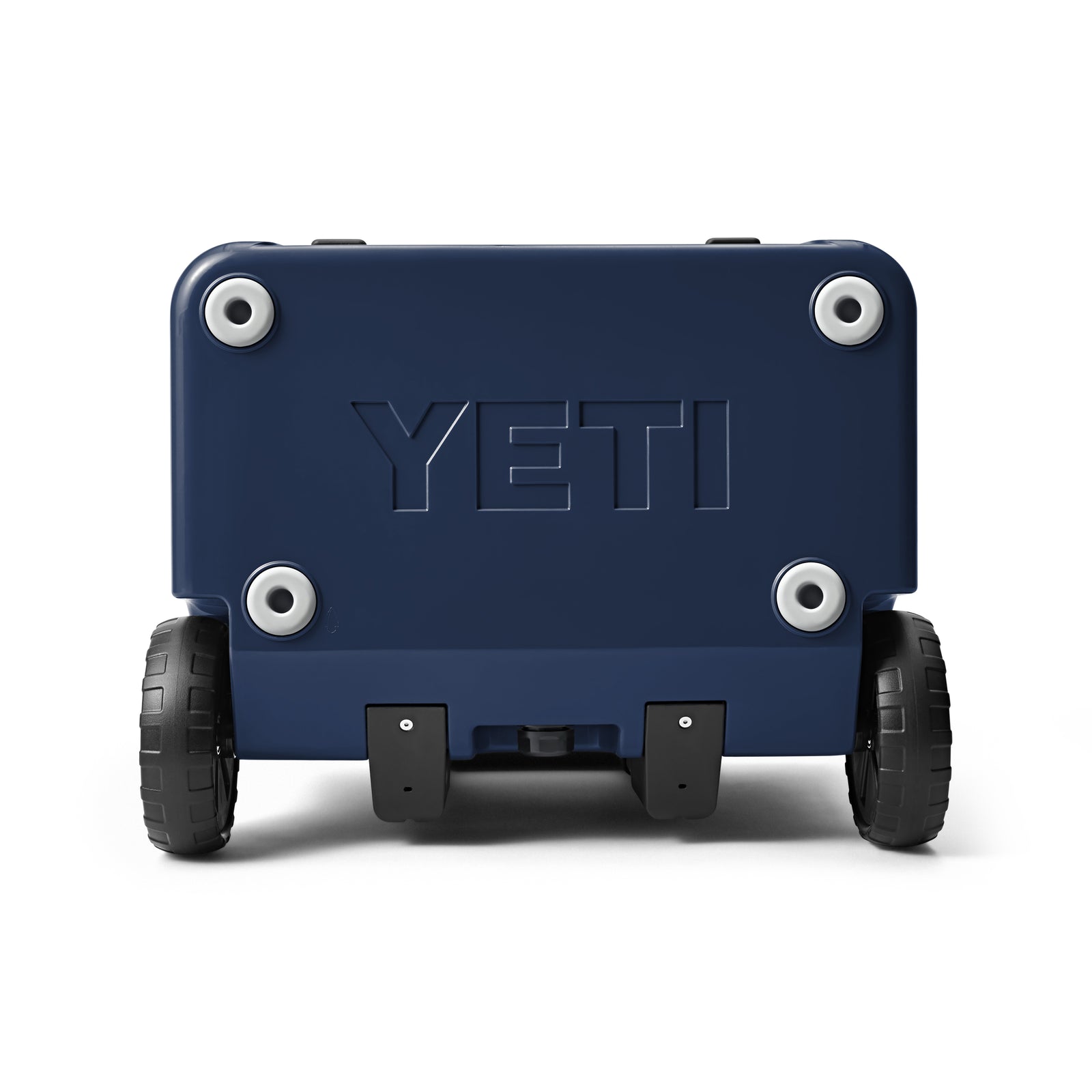 Die YETI® Kühlbox Roadie 60 in Navy ist von hinten abgebildet, wobei die robusten schwarzen Räder, die vier Schrauben mit Metallakzenten und das zentrale YETI-Logo hervorgehoben werden - ideal für eine Camping-Kühlbox.