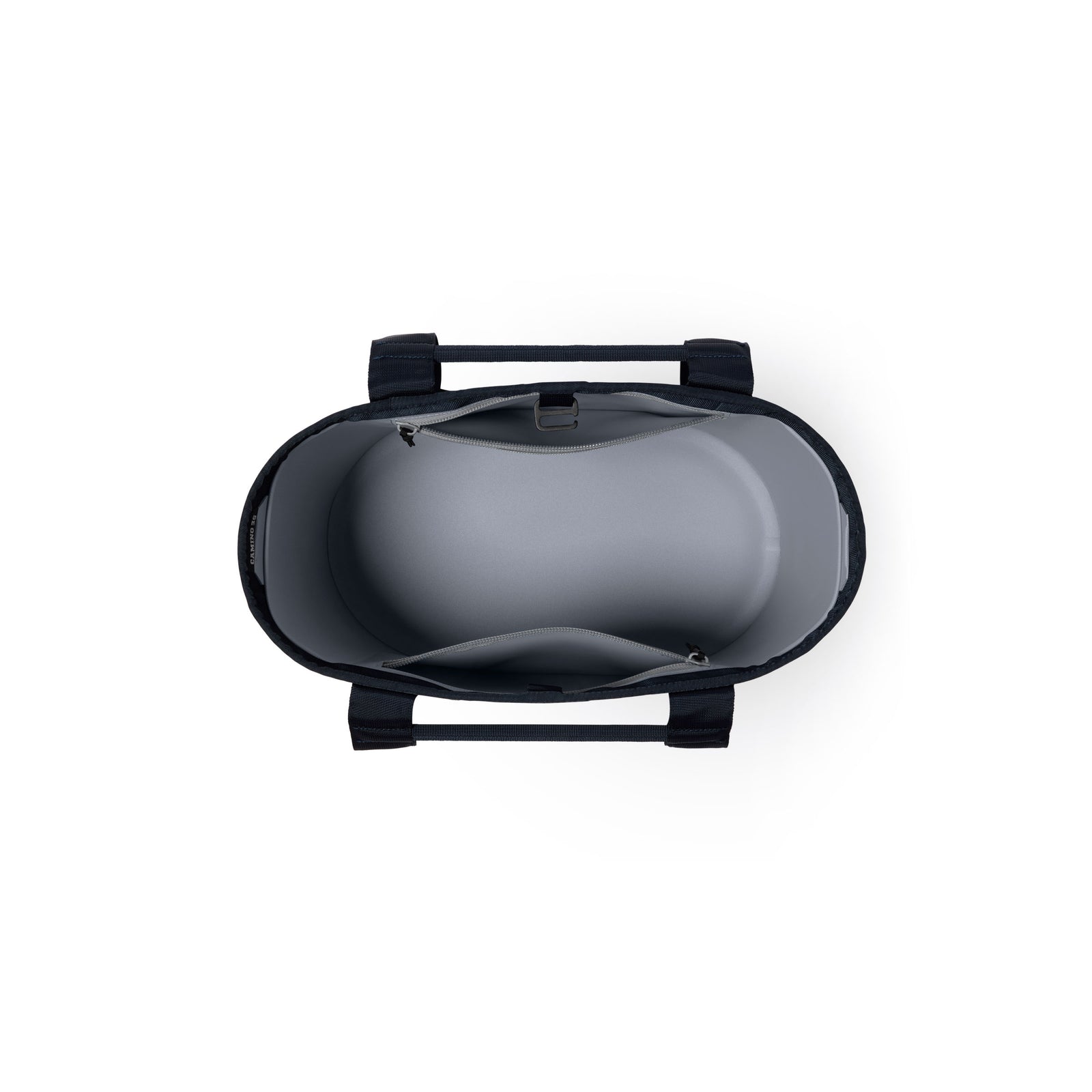 Draufsicht auf die YETI® Tragetasche Camino® Carryall 35 – Classic Navy, eine robuste Allzwecktasche mit schwarzen Tragegriffen, hellgrauem Innenfutter, einer Reißverschlusstasche und einer offenen Innentasche.