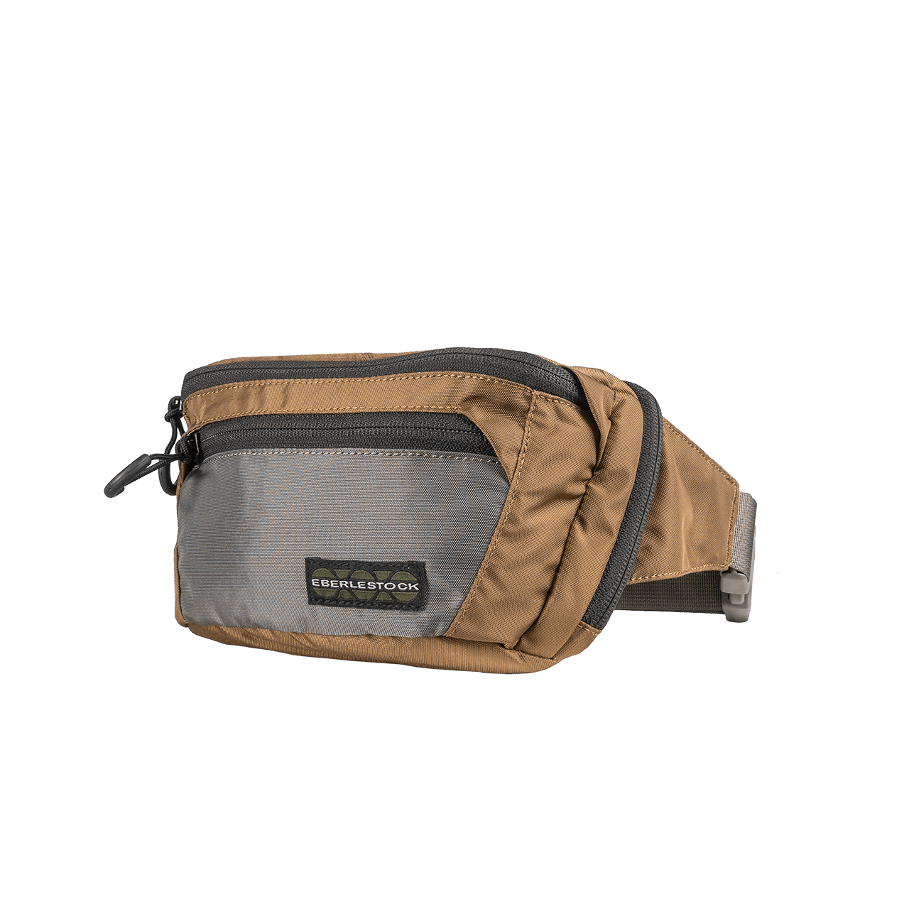Die EBERLESTOCK Bando Bag Standard ist eine braun-graue Hüfttasche mit zwei Reißverschlussfächern, verstellbarem Gurt und einem Logoaufnäher auf der Vorderseite - perfekt als taktische Crossbody-Tasche für den Alltag.