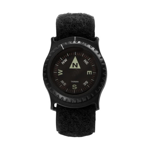 Der HELIKON-TEX T25 Armbandkompass ist ein schwarzer Kompass für das Handgelenk mit einem runden Zifferblatt, das die Himmelsrichtungen anzeigt, einem verstellbaren Armband und einer leuchtenden Nordmarkierung für zuverlässige Navigation im Freien.