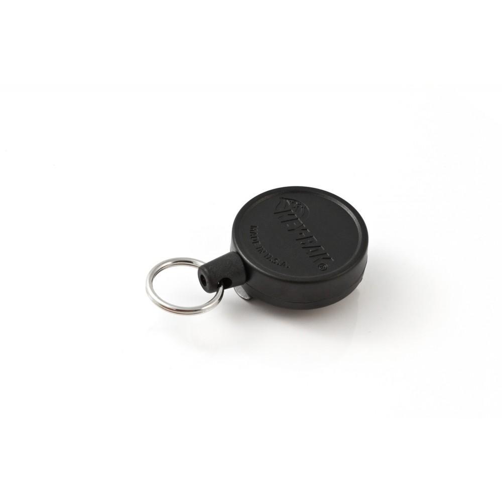 Der KEY-BAK Key-Bak 6 Black Schlüsselhalter verfügt über ein rundes Kunststoffgehäuse, eine strapazierfähige Kevlarschnur und einen Schlüsselring aus Metall, abgebildet auf einem weißen Hintergrund.