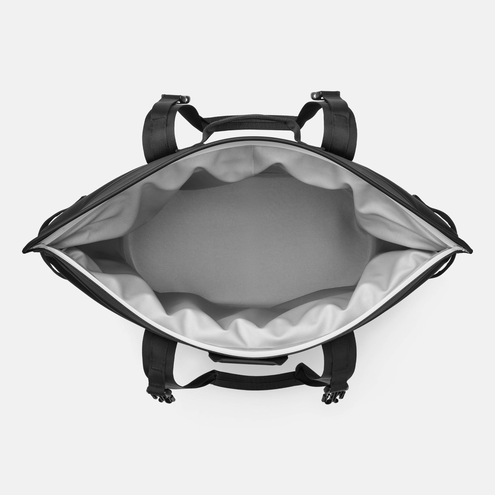 Draufsicht auf einen geöffneten, leeren YETI® Hopper M30 Soft Cooler in Charcoal mit grauem Innenfutter und schwarzen Seitengurten, der den charakteristischen Stil von YETI zeigt.