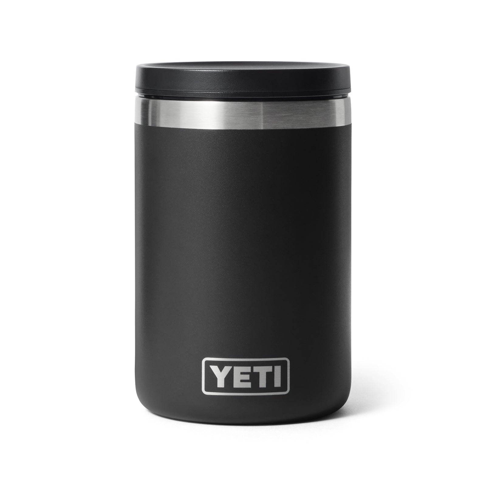 Ein schwarzer YETI® Isolierter Essensbehälter Rambler 16 oz mit Vakuumisolierung und Edelstahlrand, der das weiße YETI-Logo in der Nähe des Bodens trägt, steht aufrecht auf weißem Hintergrund.