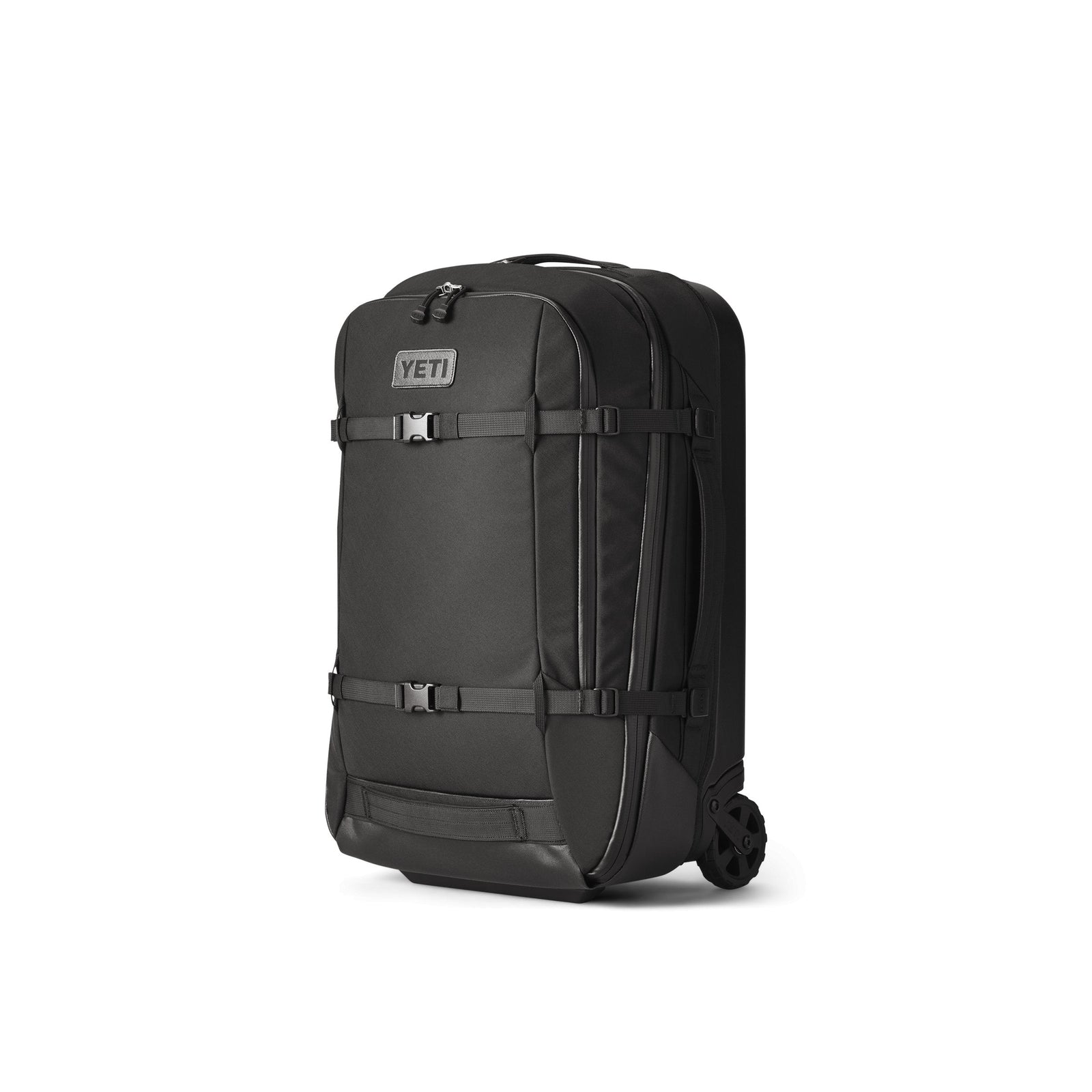 Der YETI® Koffer Crossroads® 22 - Black ist eine robuste Rollgepäcktasche aus TuffSkin-Nylon mit stabilen Rädern, Tragegriffen oben und an der Seite sowie Kompressionsriemen an der Außenseite, die auf einem schlichten weißen Hintergrund abgebildet sind.