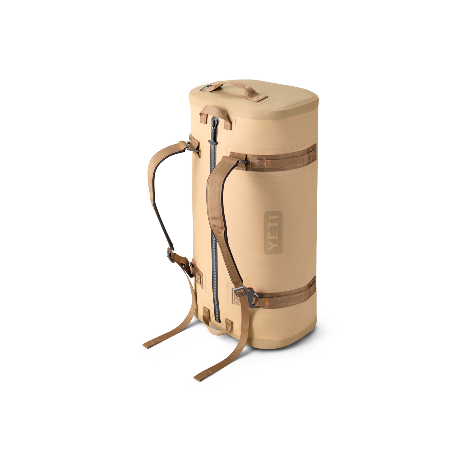 Die YETI® Reisetasche Panga 75 in Tan, ein zylindrischer Rucksack mit braunen Trägern, Frontreißverschluss und Tragegriff, von YETI, steht aufrecht vor einem schlichten weißen Hintergrund - ideal für Outdoor-Abenteuer.