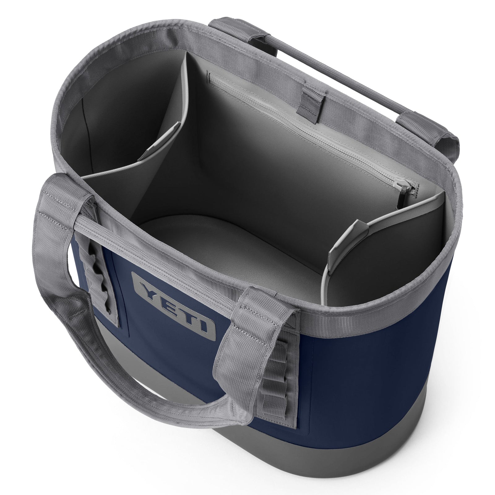 Draufsicht auf die geöffnete YETI® Tragetasche Camino® Carryall 35 - Navy, mit grauen Griffen, die den geräumigen Innenraum mit Seitentaschen und einem großen Reißverschlussfach zeigt.