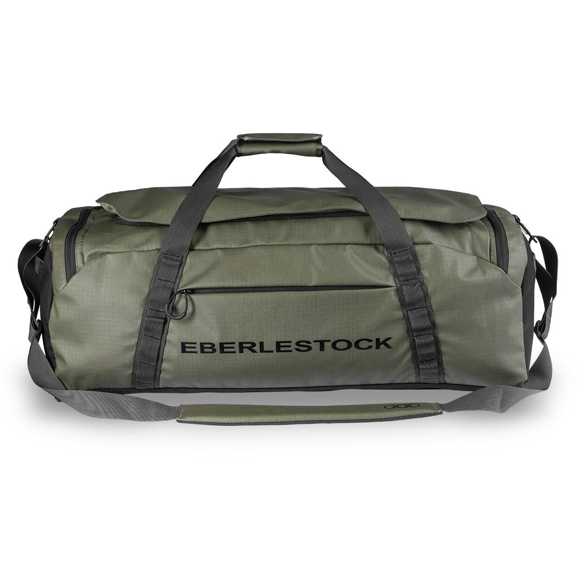 Der Eberlestock Hyllus Duffel 65 in Militärgrün verfügt über schwarze Griffe, einen Schultergurt, eine vordere Reißverschlusstasche und den Aufdruck "EBERLESTOCK" in Schwarz. Das geräumige Fassungsvermögen von 65 Litern bietet Platz für all Ihre wichtigen Dinge.