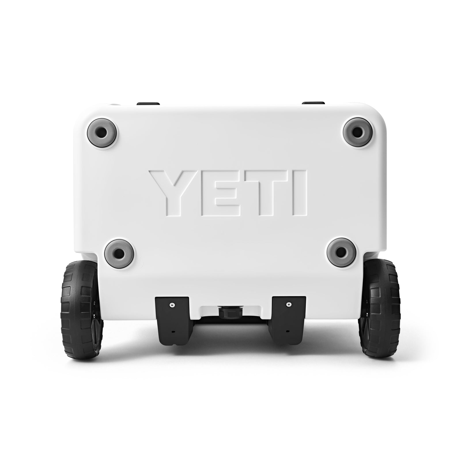 Die YETI® Kühlbox Roadie 60 -White ist von hinten zu sehen, mit dem YETI-Branding auf der Oberfläche und zwei robusten schwarzen Rädern am Boden.