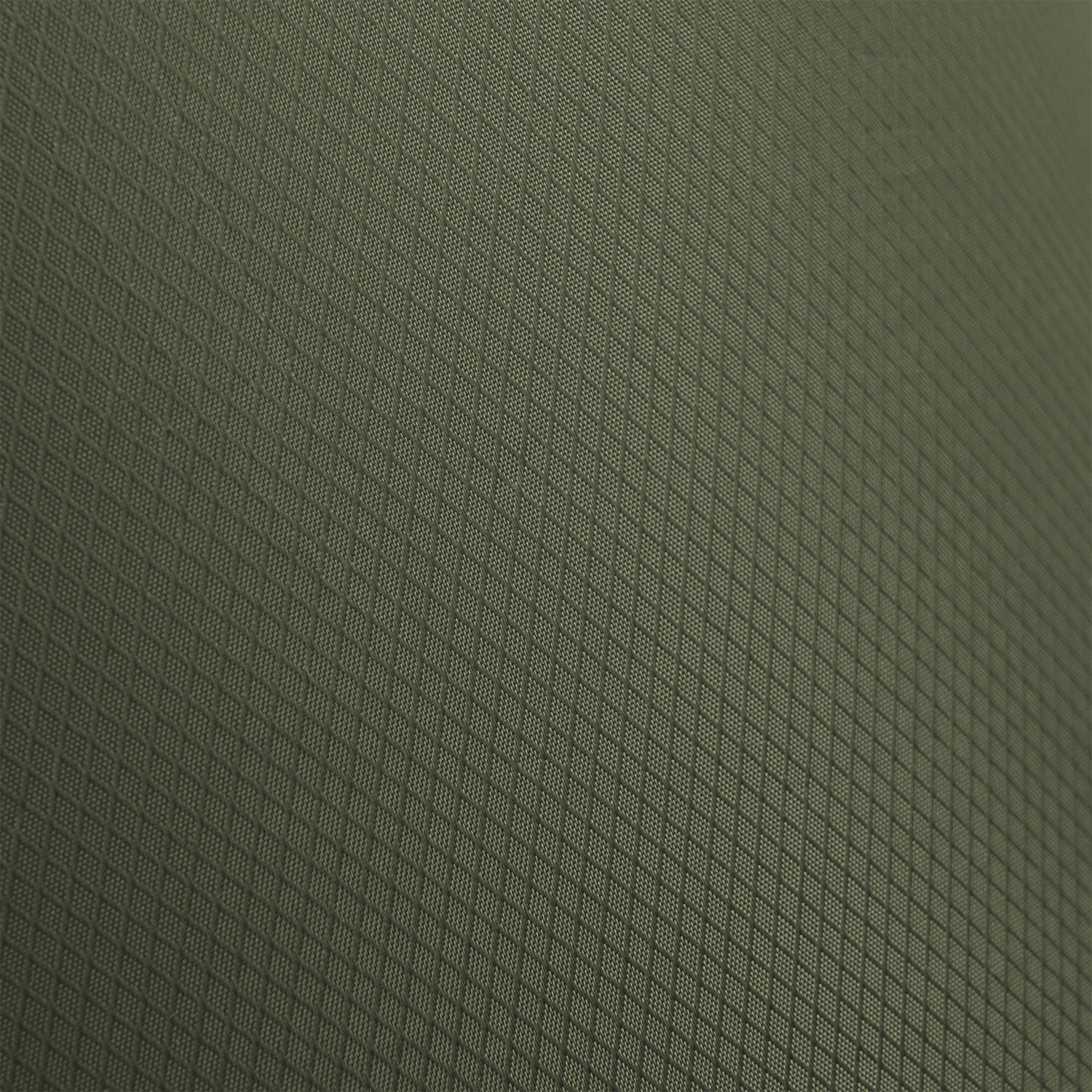 Nahaufnahme des Highlander Puff Sack Inflation Drybag von HIGHLANDER FORCES. Die strukturierte, dunkelgrüne Oberfläche mit dem sich wiederholenden Rautengittermuster sorgt für ein geometrisches, netzartiges Aussehen.
