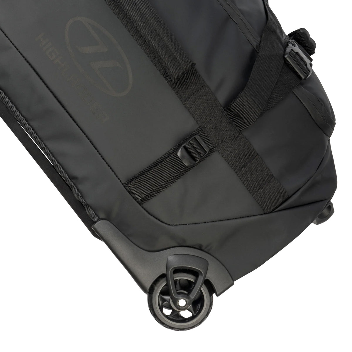 Die Nahaufnahme einer robusten Reisetasche zeigt das robuste Kunststoffrad, den Griff und die verstellbaren schwarzen Gurte - die wichtigsten Merkmale der HIGHLANDER FORCES Highlander The Trailer Duffel - 100L.