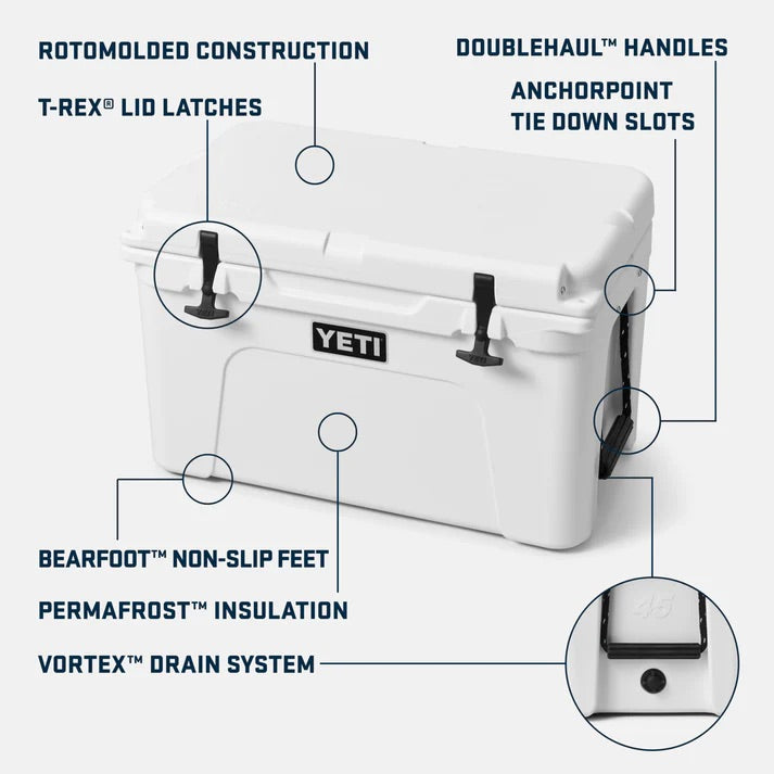 Die YETI® Kühlbox Tundra 45 - White/Blue verfügt über eine rotationsgeformte Konstruktion, T-Rex®-Deckelverschlüsse, DoubleHaul™-Griffe, AnchorPoint™-Verankerungsschlitze, rutschfeste BearFoot™-Füße, PermaFrost™-Isolierung und ein Vortex™-Ablaufsystem.