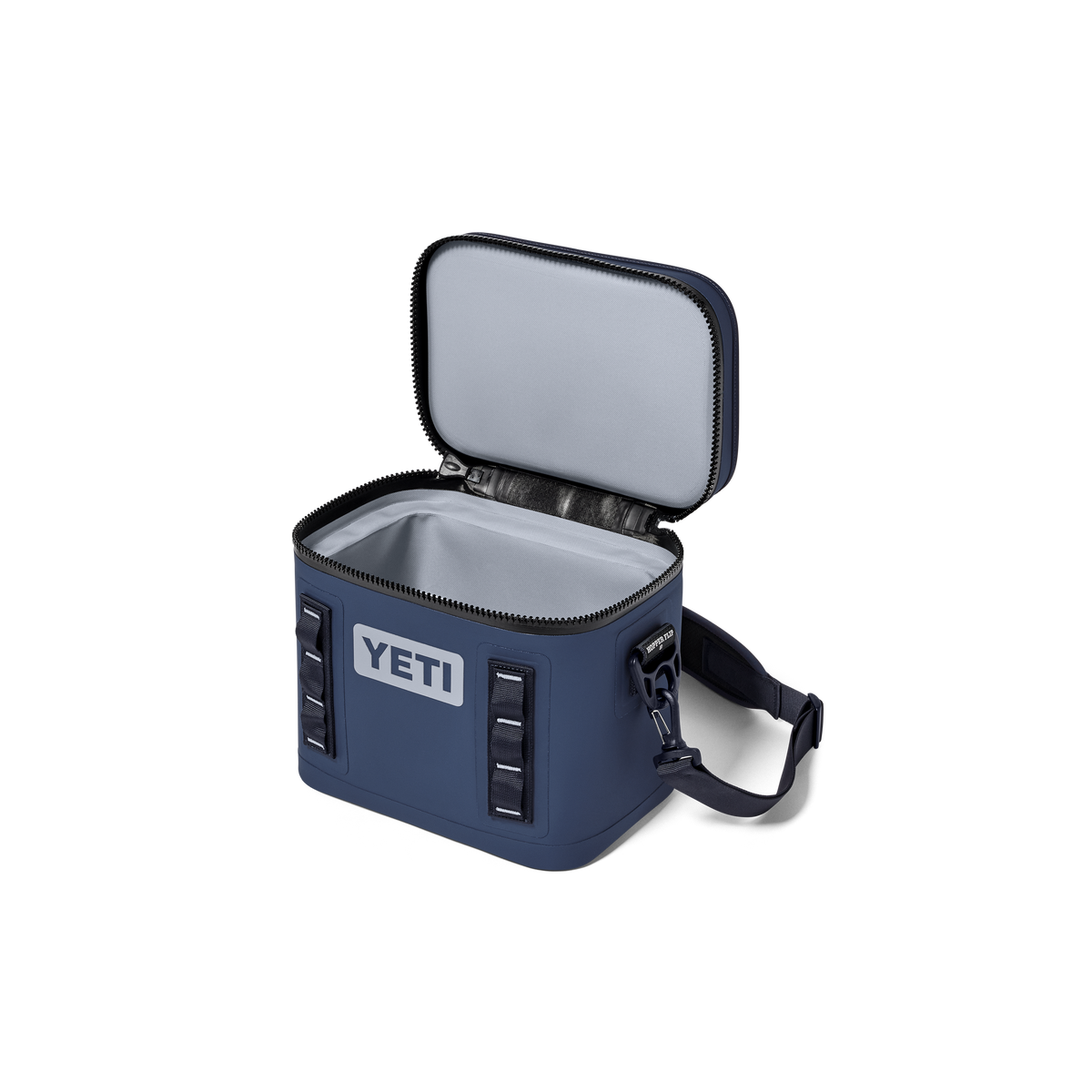 Die YETI® Kühltasche Hopper Flip® 8 - Classic Navy ist offen auf weißem Hintergrund abgebildet und verfügt über einen Schultergurt, einen Reißverschluss und äußere Schlaufen für eine hervorragende Kühlleistung bei Ihren Abenteuern.