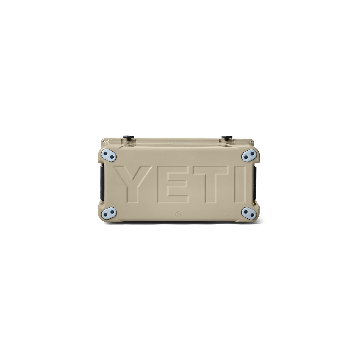 Eine hellbraune YETI®-Kühlbox „Tundra 75“ von YETI ist auf dem Rücken liegend abgebildet, wobei das große, geprägte YETI-Logo auf der Unterseite sowie die Gummifüße an jeder Ecke vor einem weißen Hintergrund hervorgehoben werden.