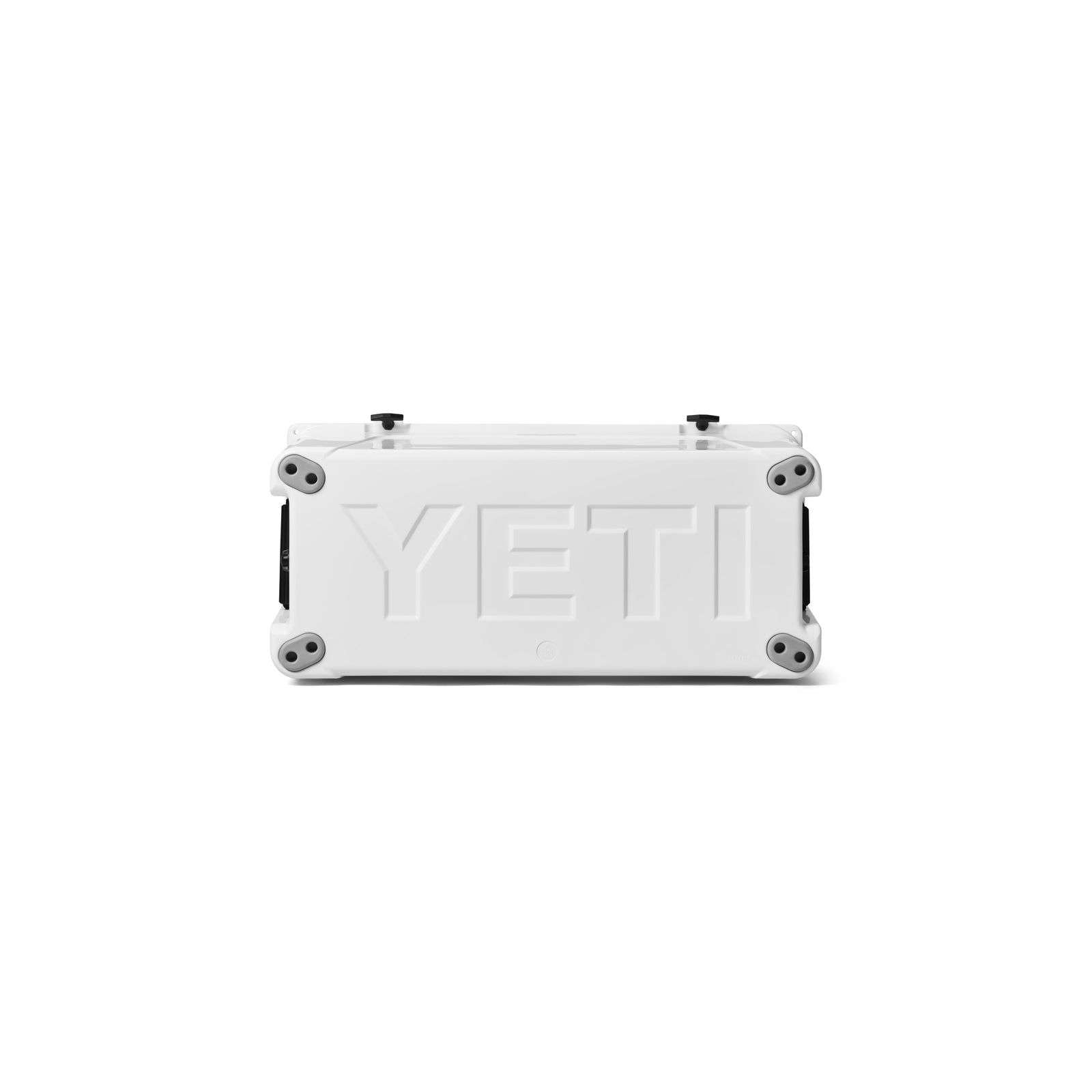 Eine weiße, rechteckige YETI®-Kühlbox „Tundra 110“ wird von der Seite gezeigt, auf der der große, geprägte Markenname „YETI“ zu sehen ist. An jeder Ecke ist ein runder Fuß zu erkennen, und der schlichte weiße Hintergrund unterstreicht ihre langanhaltende Kühlleistung.