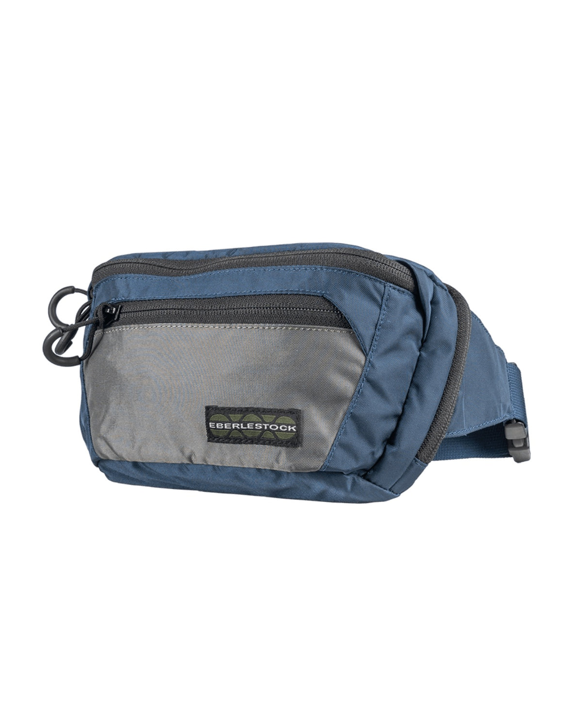 Die EBERLESTOCK Bando Bag Standard in Blau und Grau verfügt über eine Reißverschlusstasche auf der Vorderseite, ein Hauptfach, ein CCW-Fach und einen verstellbaren Gurt, abgebildet auf weißem Hintergrund.