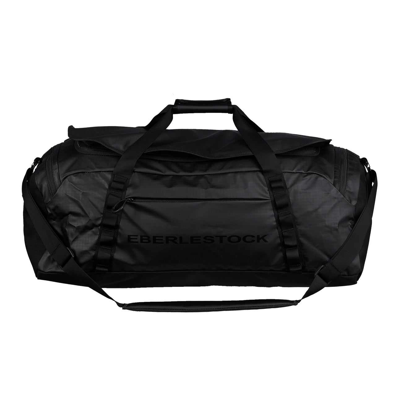 Die Eberlestock Hyllus Duffel 65 ist eine große, schwarze, wasserabweisende Tasche mit stabilen Griffen, einem Schultergurt, einem Fassungsvermögen von 65 Litern und dem EBERLESTOCK"-Schriftzug an der Seite.