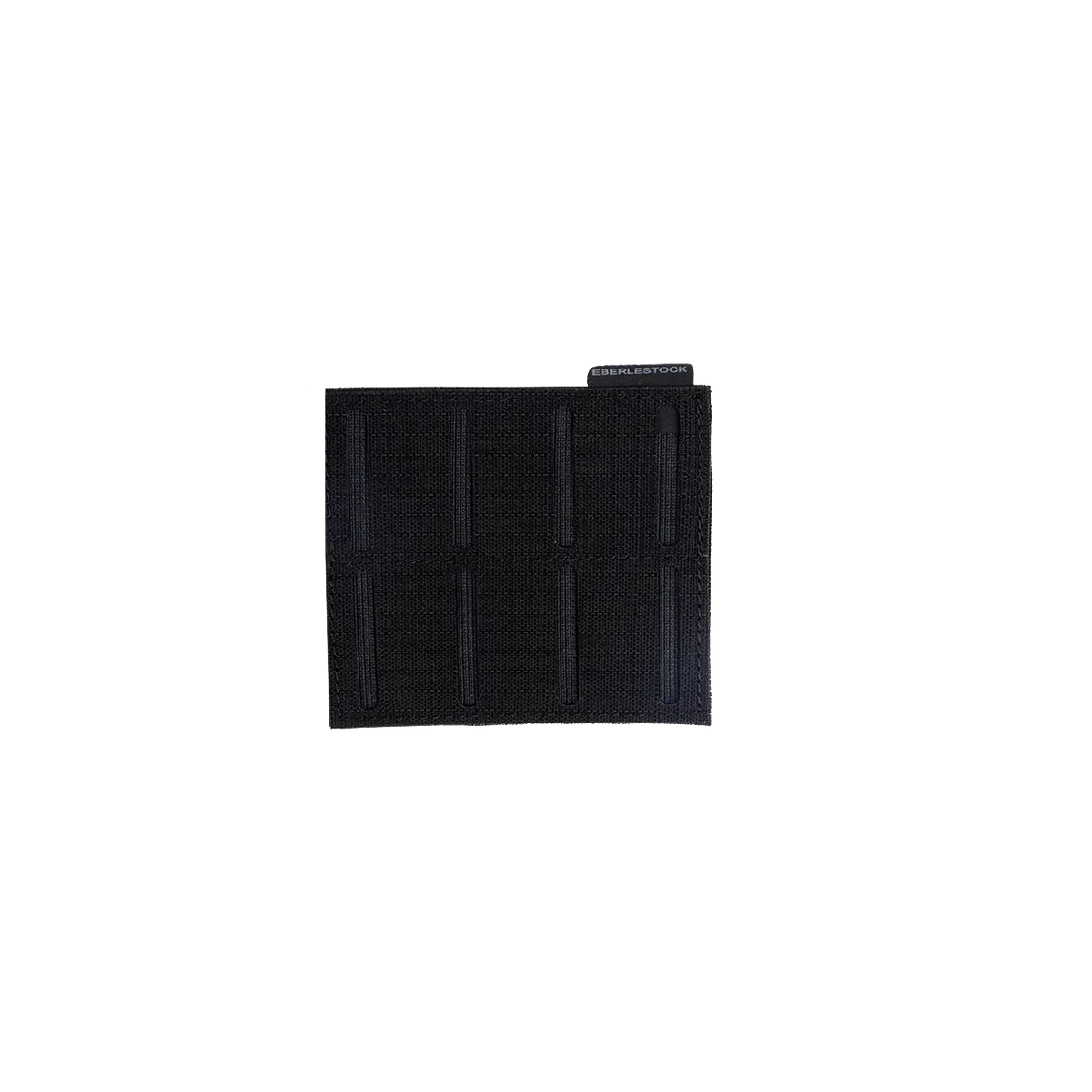 Der EBERLESTOCK Molle Adapter 3x2 ist ein schwarzer, quadratischer Aufnäher aus strapazierfähigem 500D Nylon, mit vertikalen Nähten und einem kleinen Anhänger am oberen rechten Rand, abgebildet auf einem schlichten weißen Hintergrund.