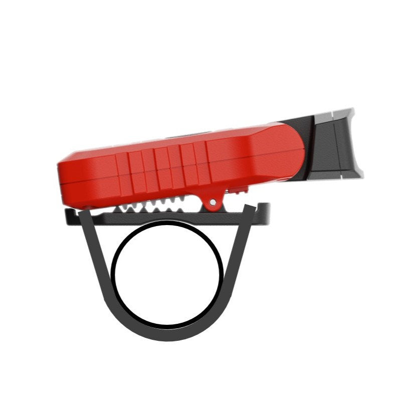 Seitenansicht einer kompakten, rot-schwarzen Fahrradklingel, die am Lenker montiert wird - ideal für Fahrräder mit der NORDRIDE Clipleuchte Scout Red oder ähnlichem Zubehör für die Außenbeleuchtung.