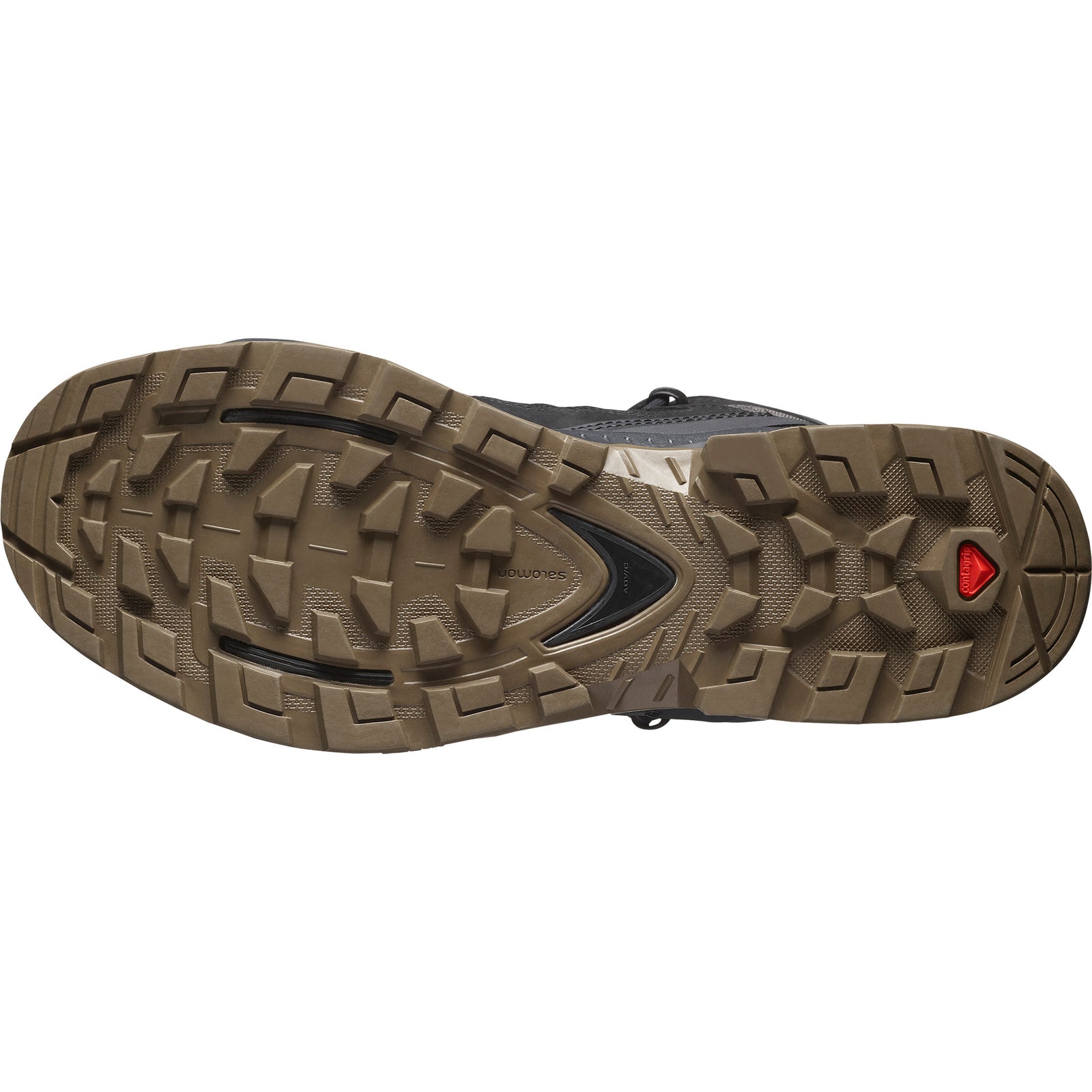 Nahaufnahme der robusten braunen Gummilaufsohle des SALOMON TRACKER QUEST TRACKER GTX Black/Asphalt/Coyote, mit einem robusten Profil für die Traktion und einem roten Dreieckslogo in der Nähe des Randes, das den Gore-Tex-Schutz anzeigt.
