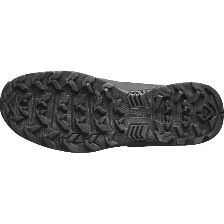 Das Bild zeigt die schwarze Gummisohle des SALOMON FORCES Salomon X ULTRA FORCES MID, die mit tiefen, multidirektionalen Stollen für überragende Traktion und Grip sorgt - perfekt für Wanderungen oder Trailrunning.