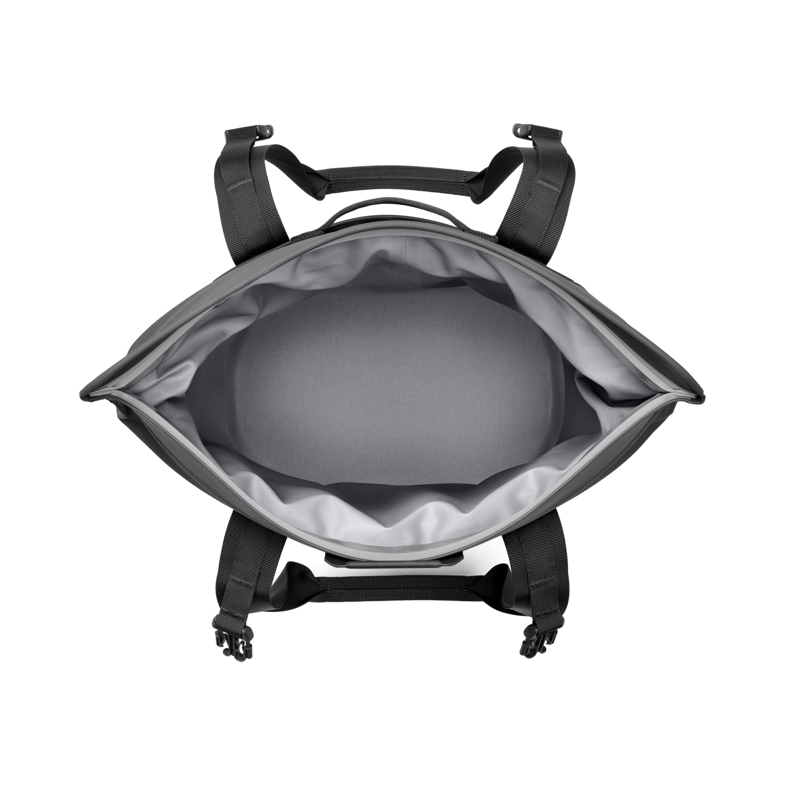 Draufsicht auf einen geöffneten YETI® Hopper M15 Soft Cooler - Charcoal von YETI mit schwarzen Gurten, einem geräumigen hellgrauen Innenraum und einer gepolsterten Rückwand.