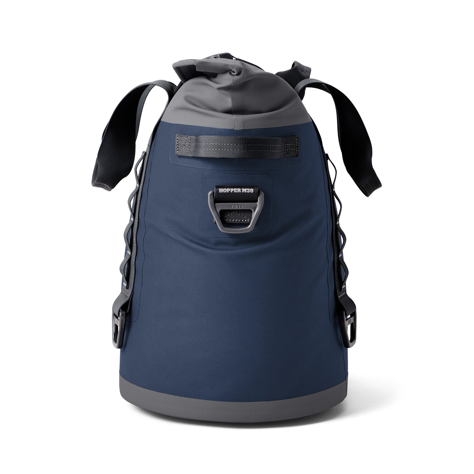 Die YETI® Hopper M30 Soft Cooler - Navy von YETI hat ein blau-graues, isoliertes Design, schwarze Gurte, einen Frontgriff, MagShield Access für einfaches Öffnen, einen runden Boden und eine verstärkte Konstruktion für lange Haltbarkeit.