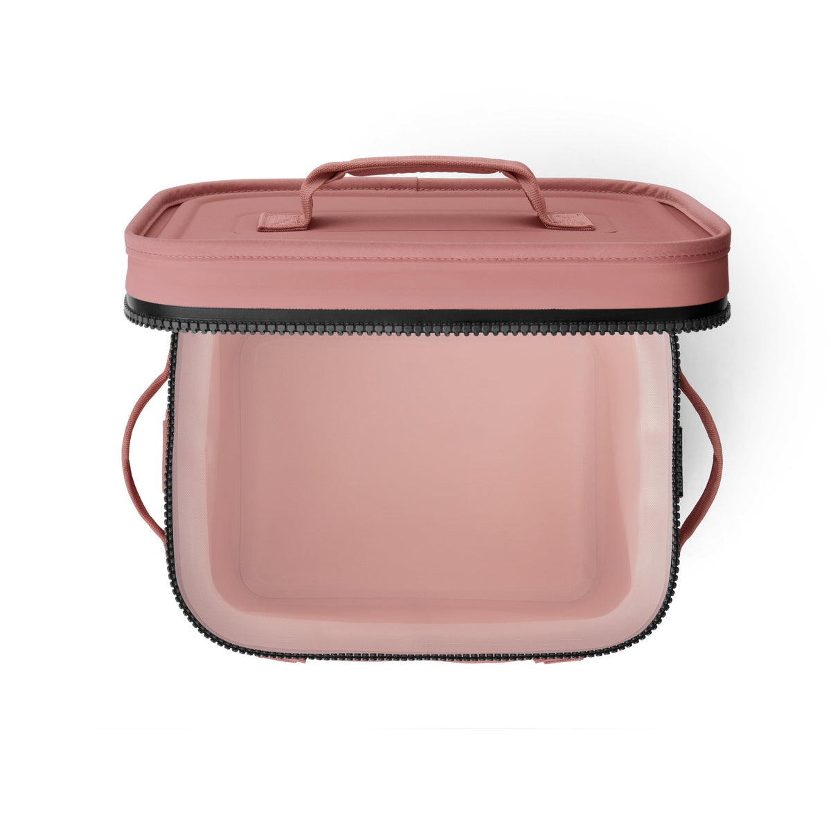 Die YETI® Kühltasche Hopper Flip® 12 in Sandstone Pink ist eine rechteckige, weiche Kühltasche mit einem Deckel mit Reißverschluss, einem Griff, transparenten Seiten und abgerundeten Kanten, abgebildet auf weißem Hintergrund.