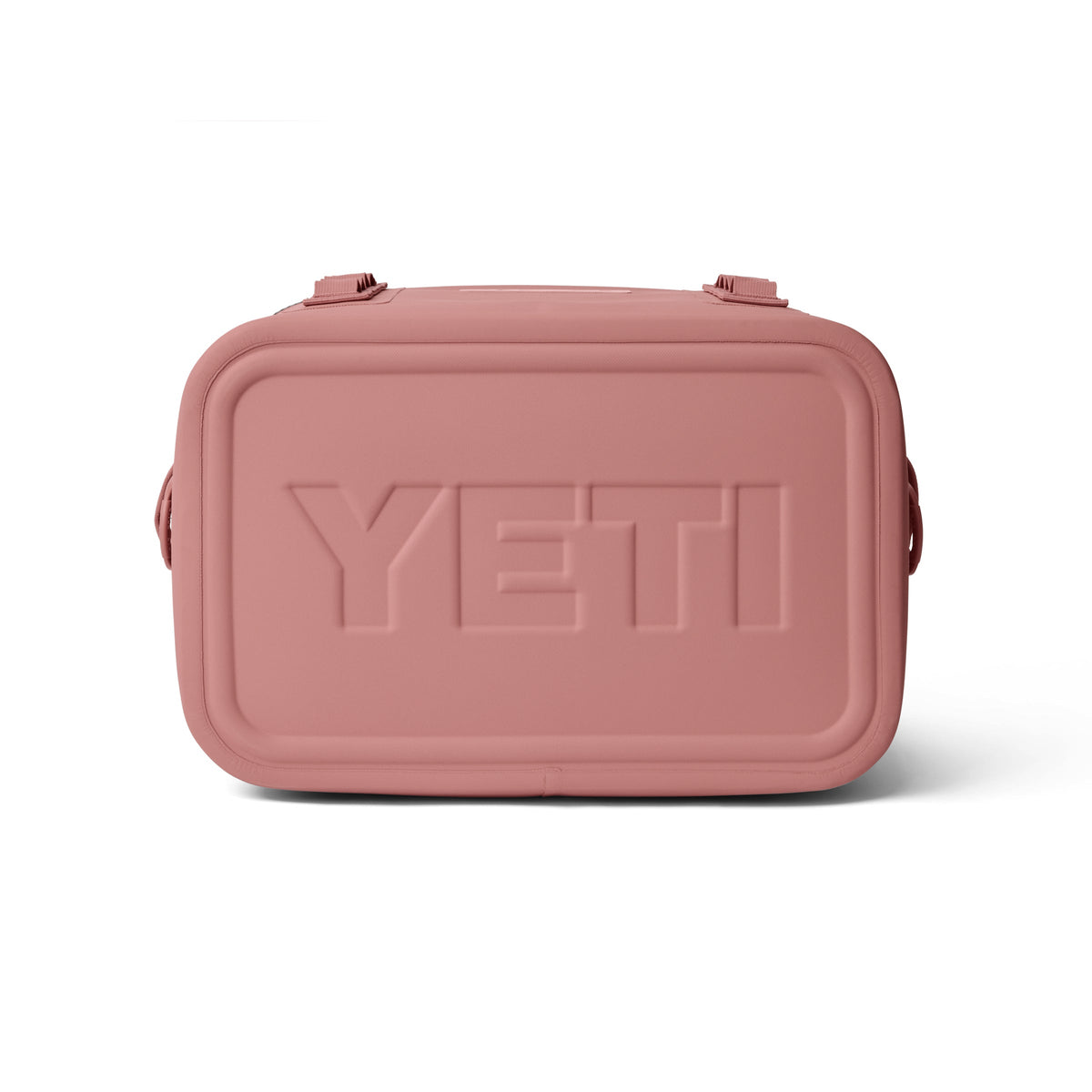 Vorderansicht der rechteckigen YETI® Kühltasche Hopper Flip® 18 Soft Cooler in Sandstone Pink mit abgerundeten Kanten, zwei oberen Clips und dem eingeprägten YETI-Logo auf der Vorderseite.