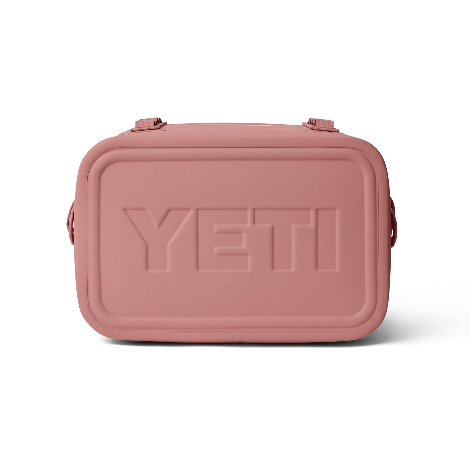 Vorderansicht der rechteckigen YETI® Kühltasche Hopper Flip® 18 Soft Cooler in Sandstone Pink mit abgerundeten Kanten, zwei oberen Clips und dem eingeprägten YETI-Logo auf der Vorderseite.