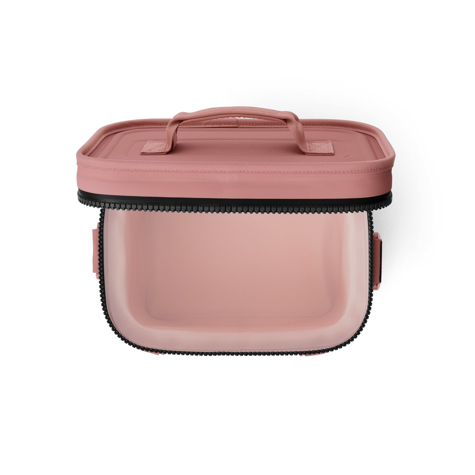 Abgebildet ist eine rechteckige, transparente YETI® Kühltasche Hopper Flip® 8 in Sandstone Pink mit oberem Reißverschluss und Deckelgriff von oben auf weißem Hintergrund.